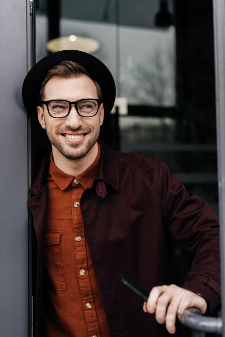 cheerful stylish man in eyeglasses and trendy hat